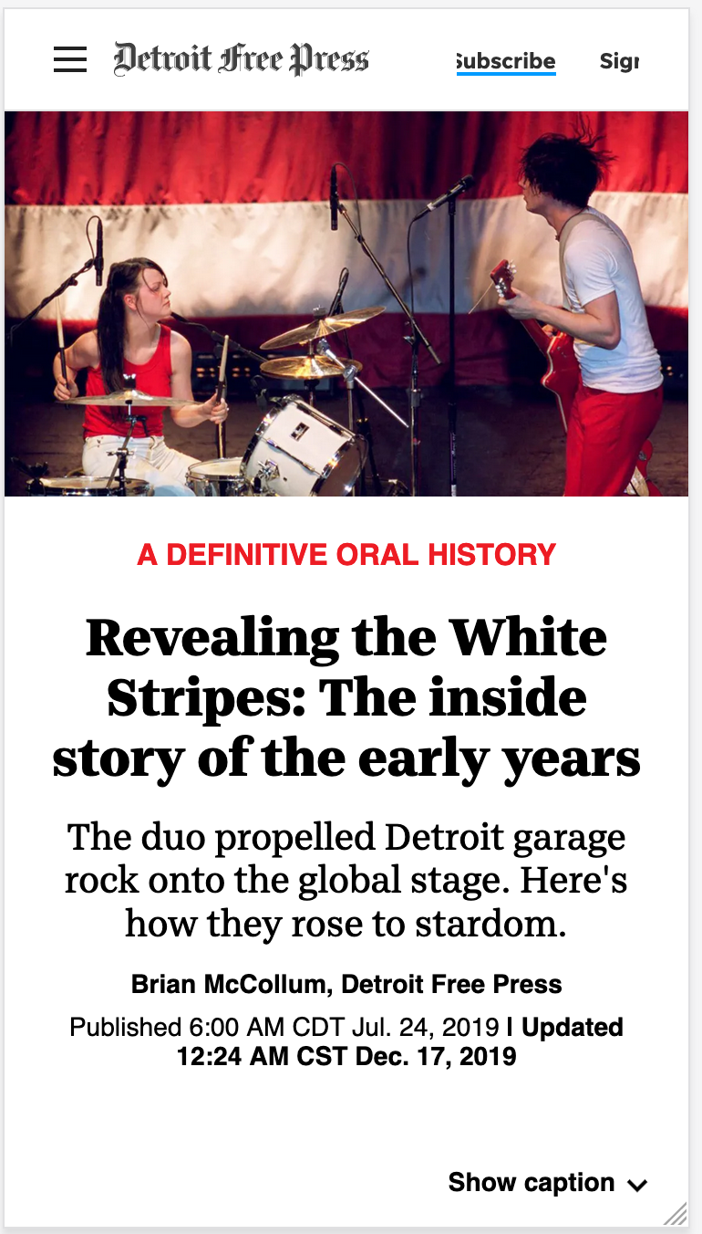 A mobile-sized flat topper with an image of band the White Stripes performing